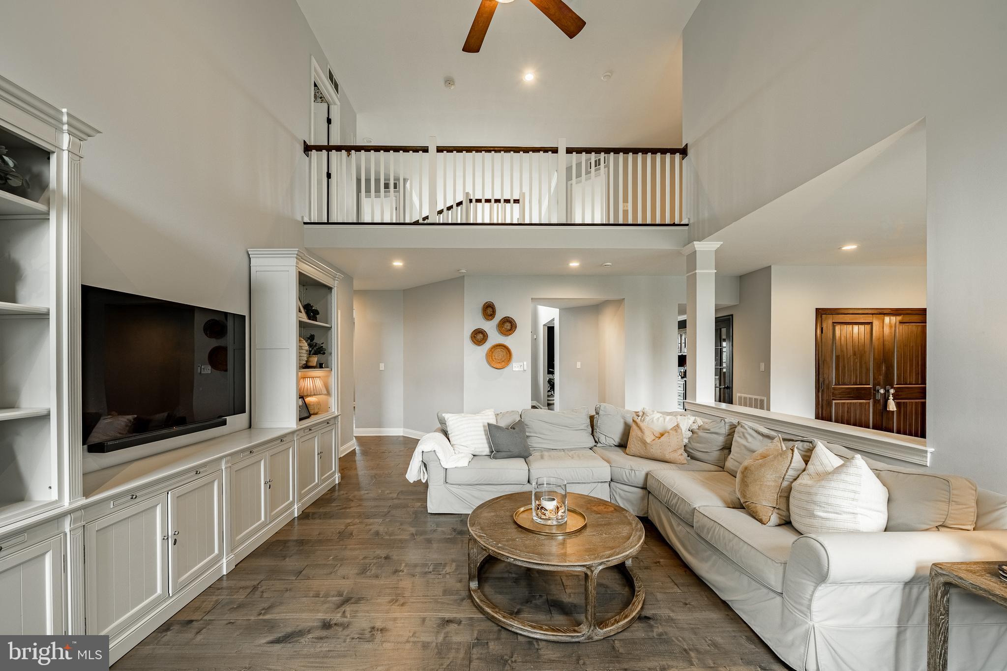 2084 Flowing Springs Road Chester Springs, PA 19425 - Photo 24 of 73 a living room with furniture and a flat screen tv