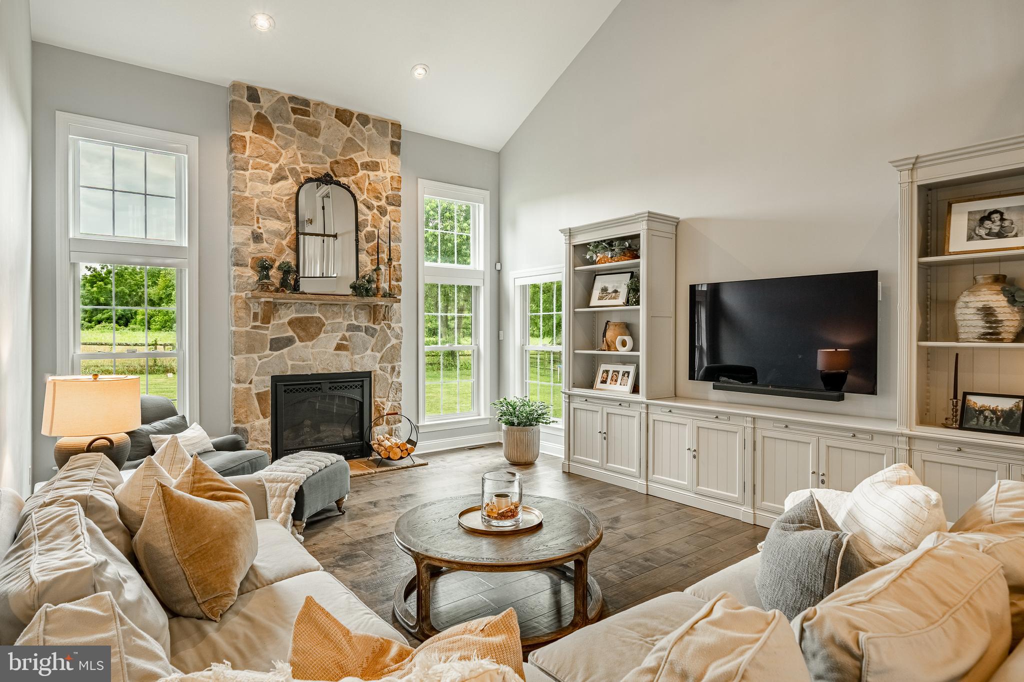 2084 Flowing Springs Road Chester Springs, PA 19425 - Photo 25 of 73 a living room with furniture a flat screen tv and a large window