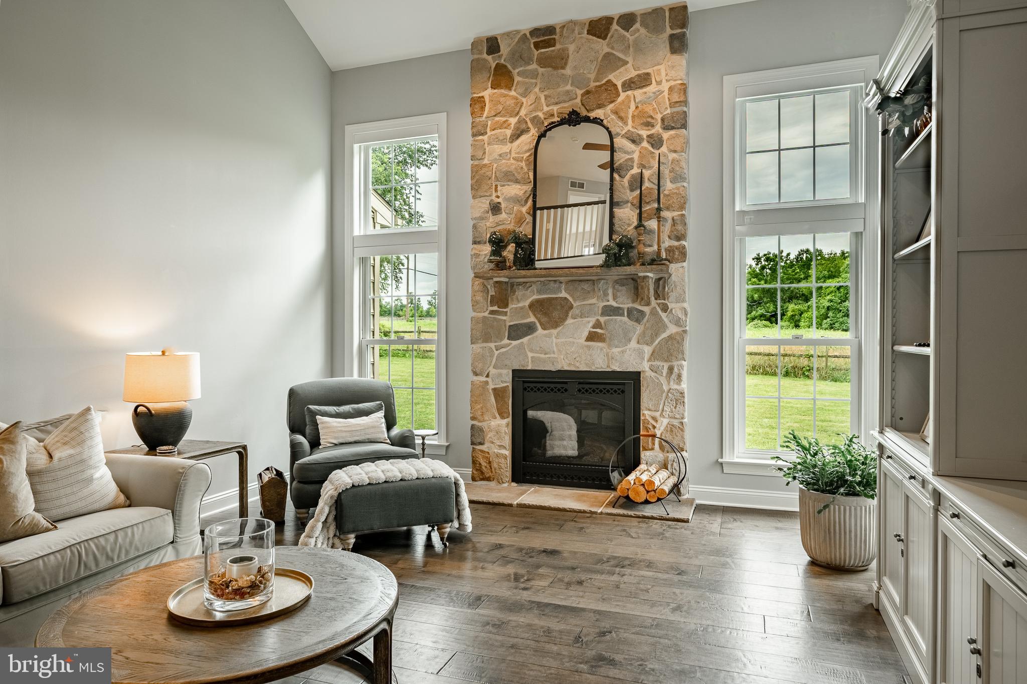 2084 Flowing Springs Road Chester Springs, PA 19425 - Photo 26 of 73 a living room with furniture and a fireplace