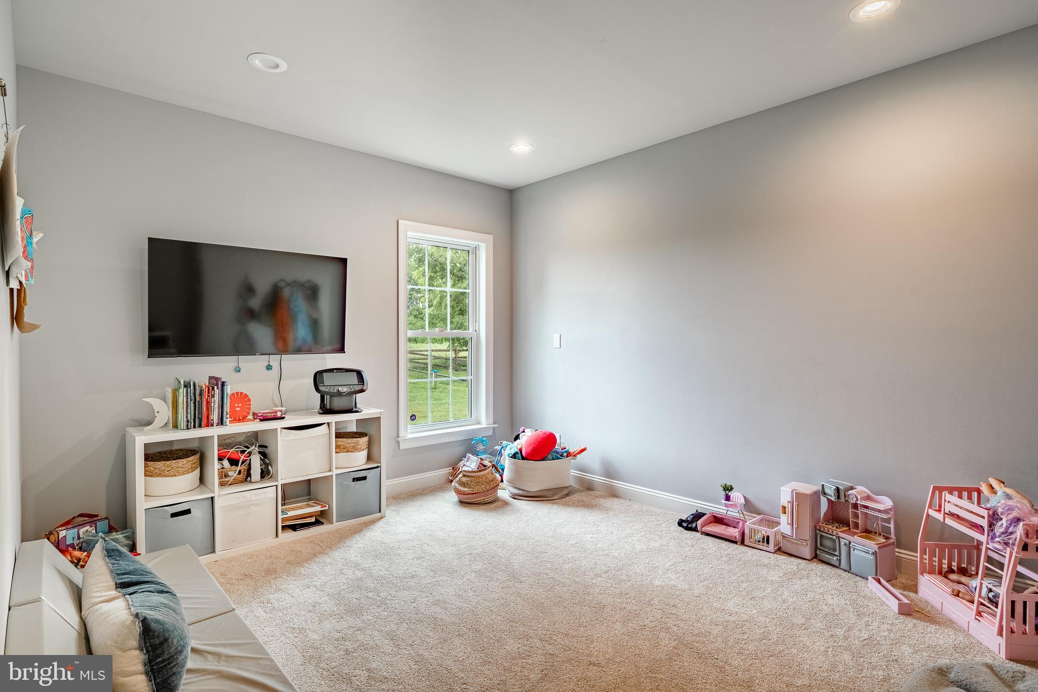 2084 Flowing Springs Road Chester Springs, PA 19425 - Photo 27 of 73 a living room with furniture and a flat screen tv
