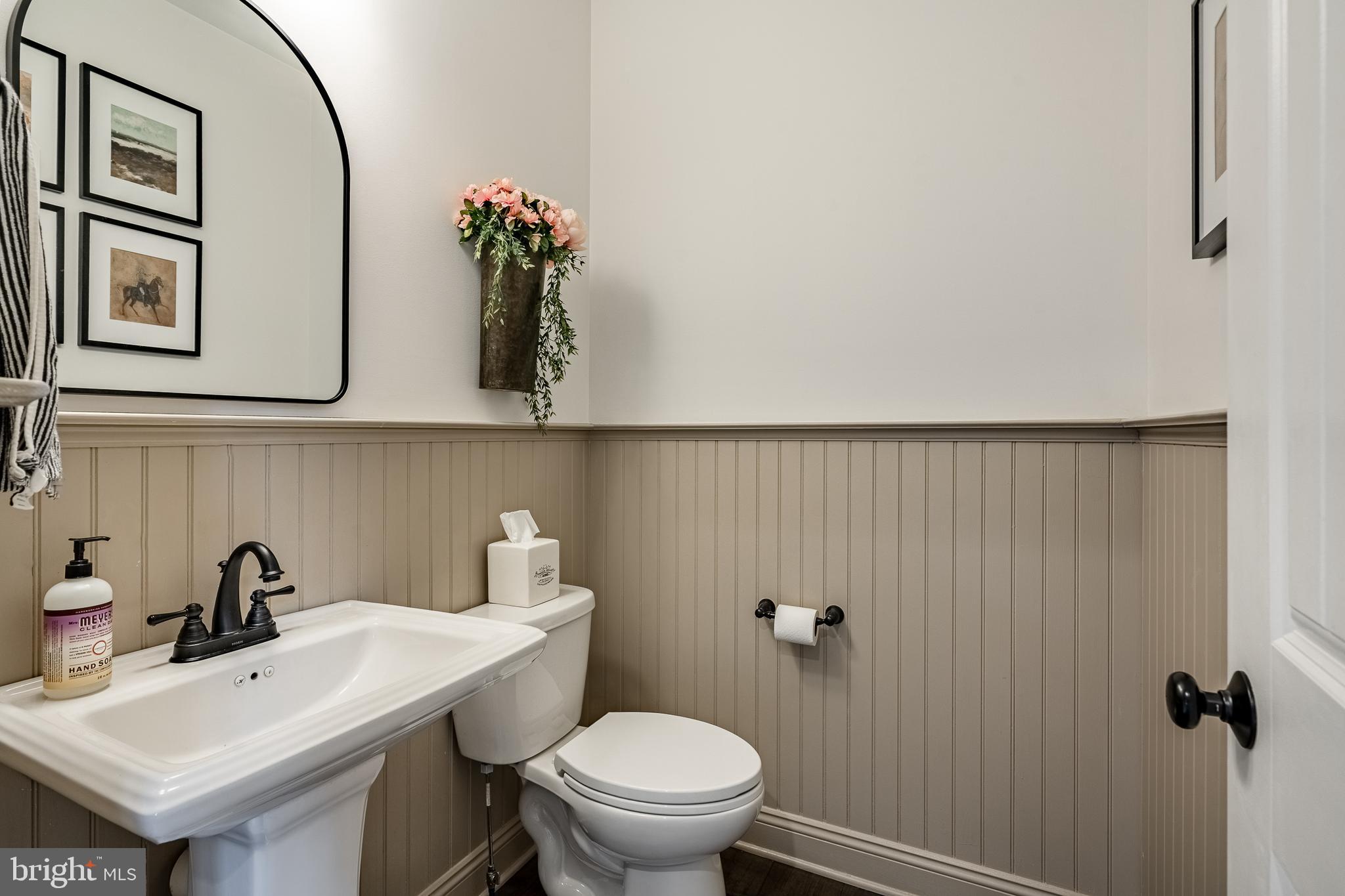 2084 Flowing Springs Road Chester Springs, PA 19425 - Photo 28 of 73 a bathroom with a toilet sink and mirror