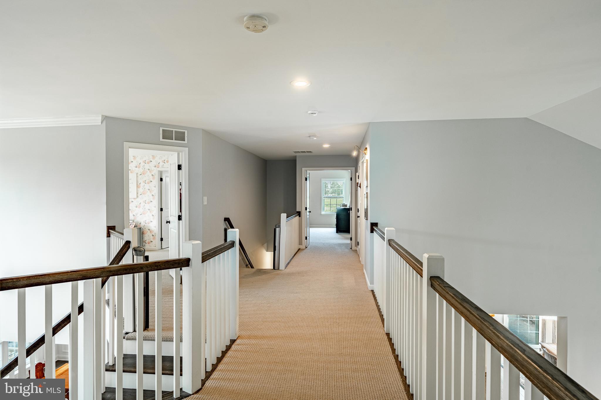 2084 Flowing Springs Road Chester Springs, PA 19425 - Photo 30 of 73 a view of a hallway with wooden floor and stairs