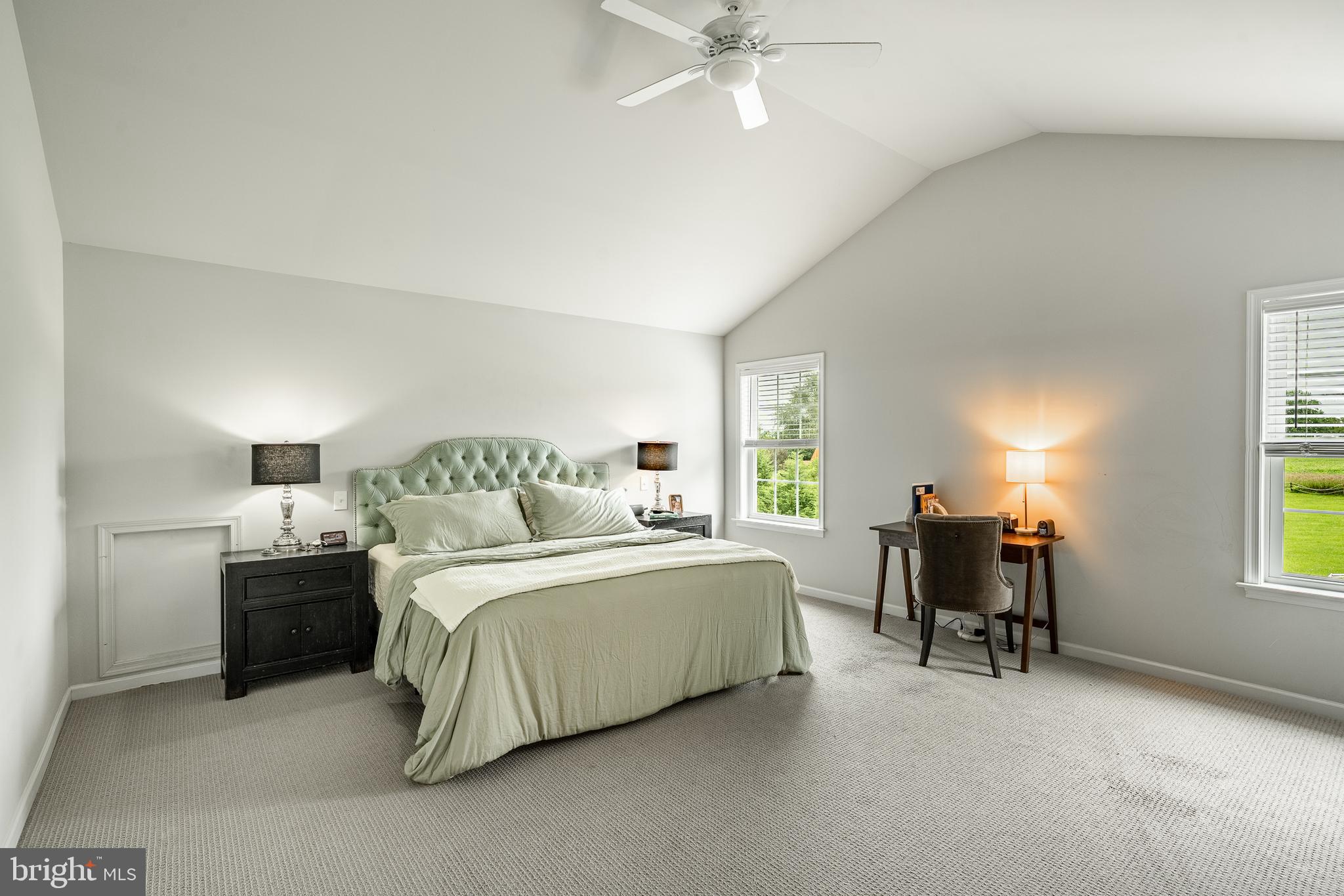 2084 Flowing Springs Road Chester Springs, PA 19425 - Photo 33 of 73 a spacious bedroom with a bed and a chandelier