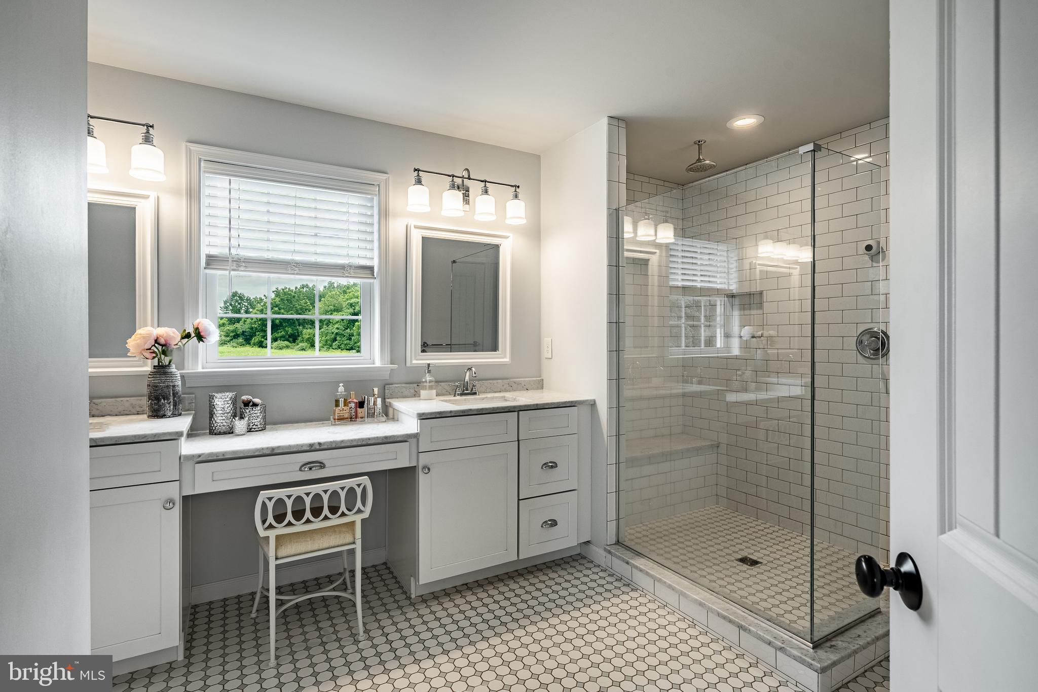 2084 Flowing Springs Road Chester Springs, PA 19425 - Photo 36 of 73 a bathroom with a shower sink and mirror