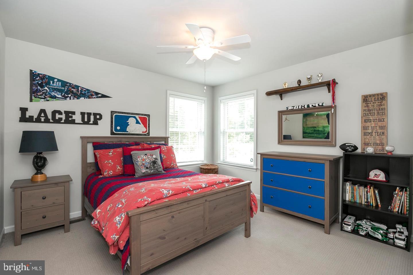 2084 Flowing Springs Road Chester Springs, PA 19425 - Photo 44 of 73 a bedroom with a bed and a bookshelf