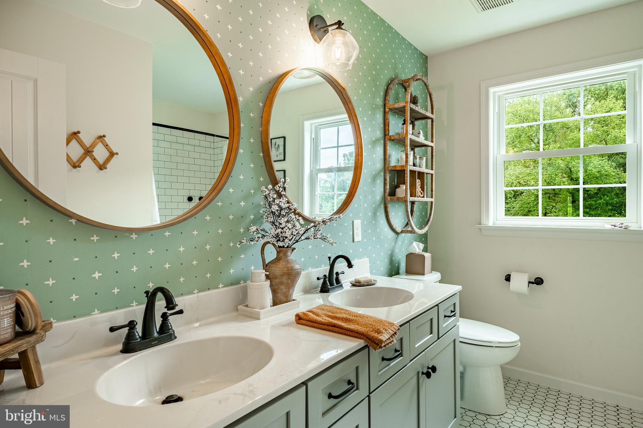 2084 Flowing Springs Road Chester Springs, PA 19425 - Photo 45 of 73 a bathroom with a granite countertop toilet a sink and a mirror