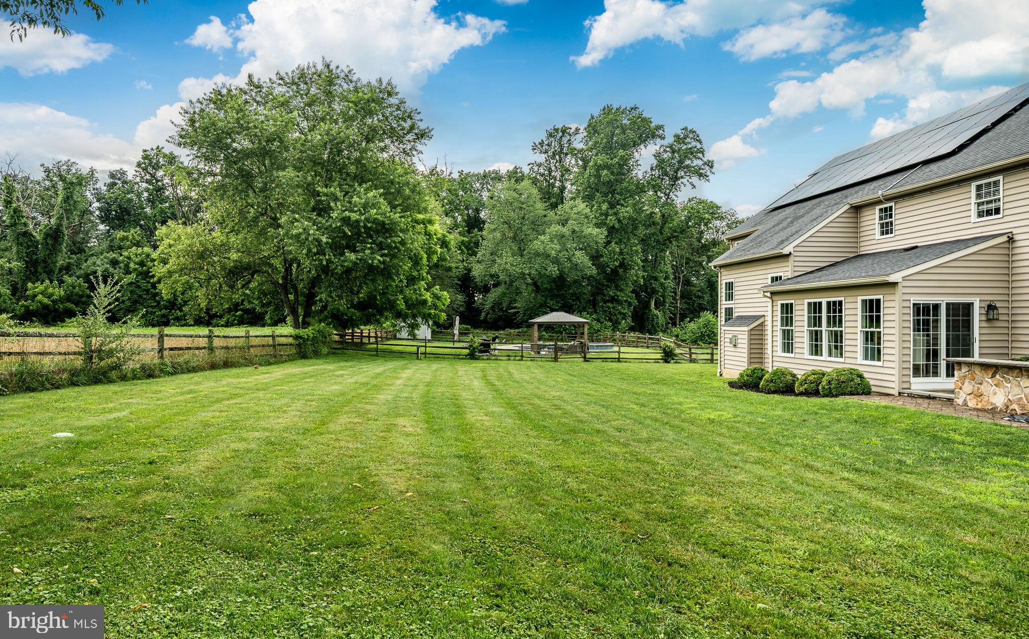2084 Flowing Springs Road Chester Springs, PA 19425 - Photo 48 of 73 a view of a house with a backyard