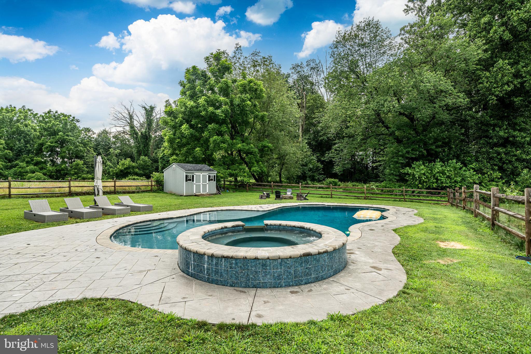 2084 Flowing Springs Road Chester Springs, PA 19425 - Photo 54 of 73 a view of a swimming pool with a yard