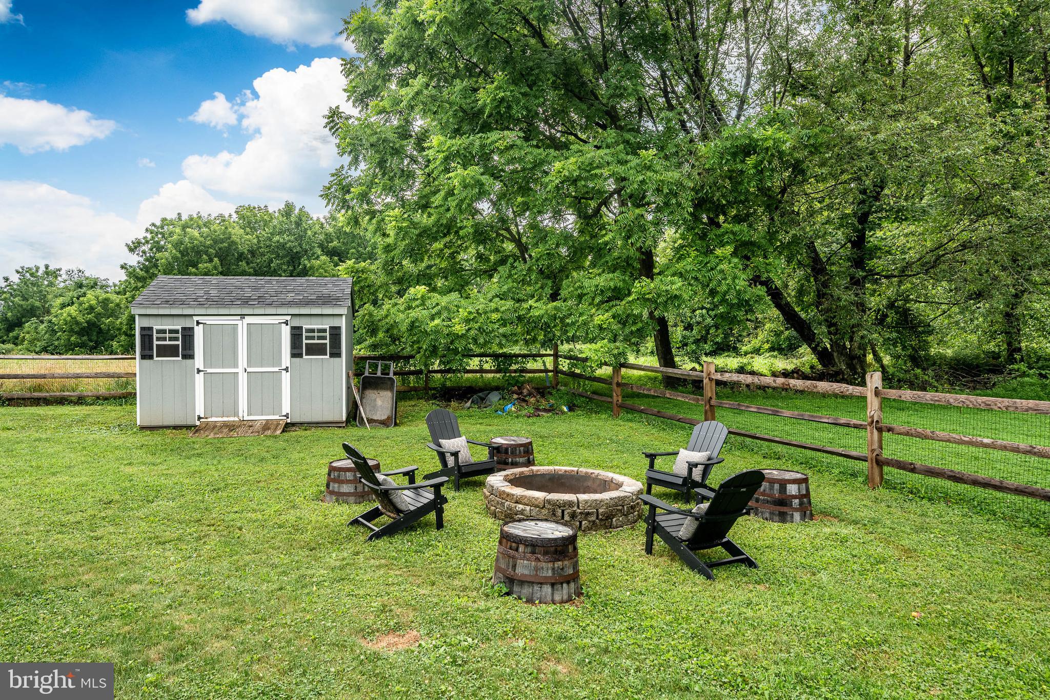2084 Flowing Springs Road Chester Springs, PA 19425 - Photo 55 of 73 a view of a house with garden and a patio