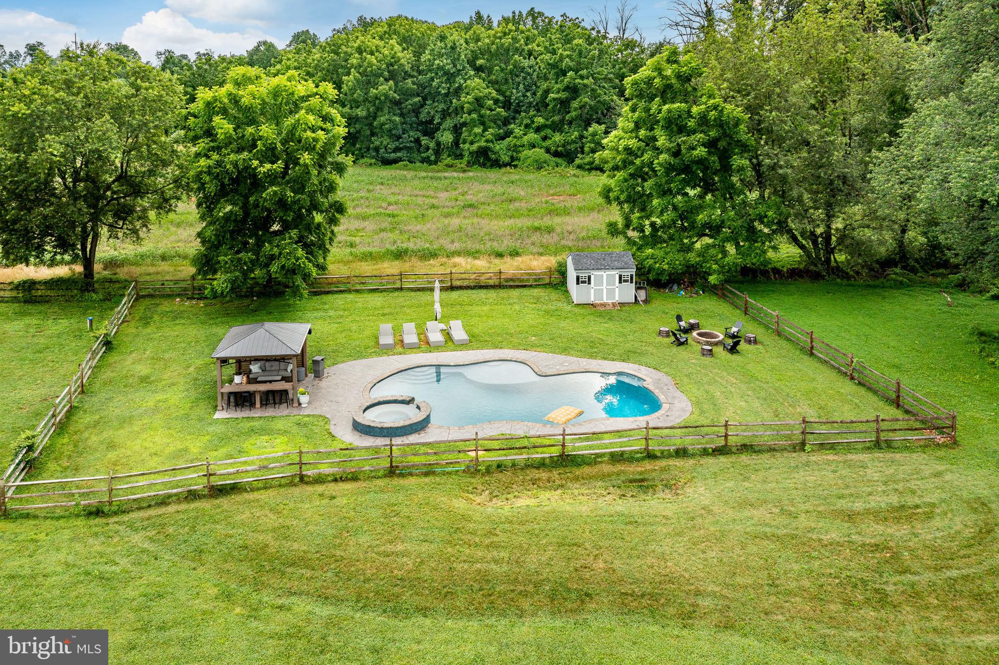 2084 Flowing Springs Road Chester Springs, PA 19425 - Photo 57 of 73 a view of a swimming pool with a yard