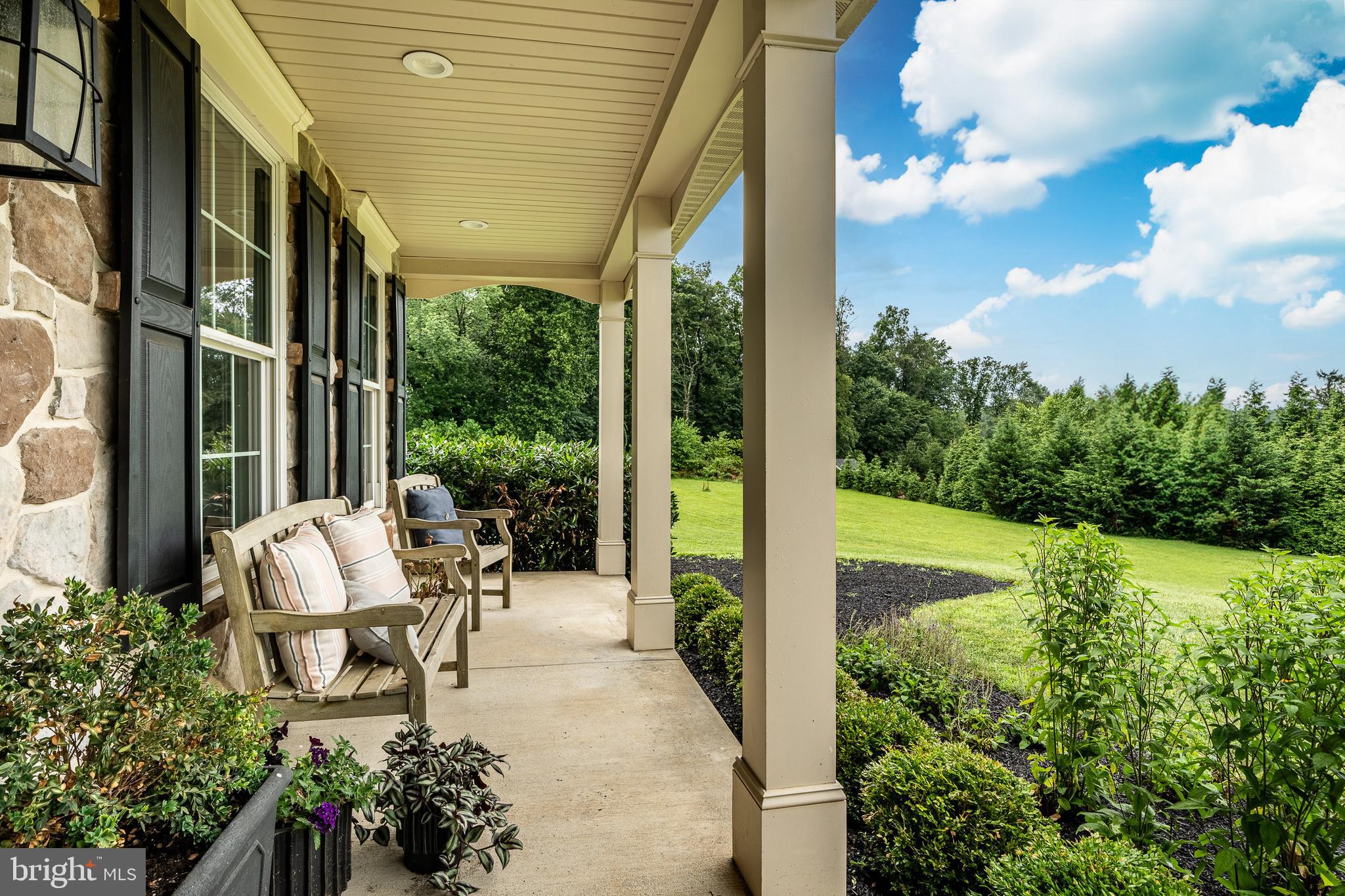 2084 Flowing Springs Road Chester Springs, PA 19425 - Photo 6 of 73 a view of a patio with table and chairs and potted plants