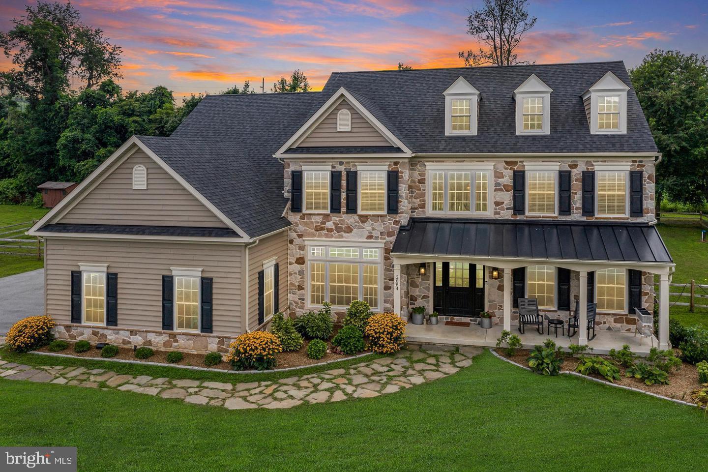 2084 Flowing Springs Road Chester Springs, PA 19425 - Photo 69 of 73 front view of a house with a yard