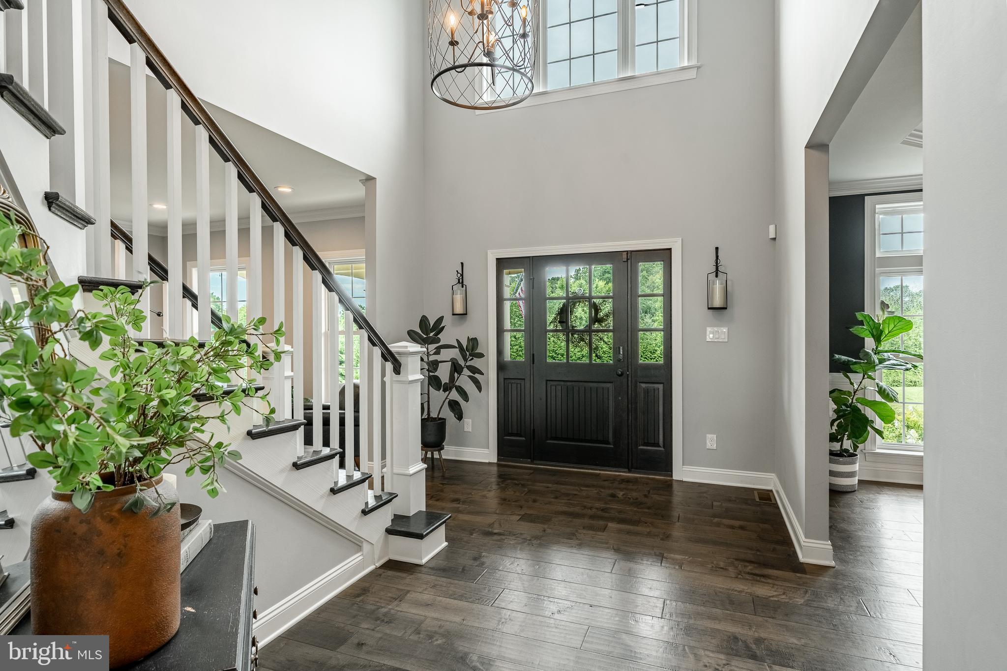 2084 Flowing Springs Road Chester Springs, PA 19425 - Photo 8 of 73 a view of entryway with wooden floor and stairs