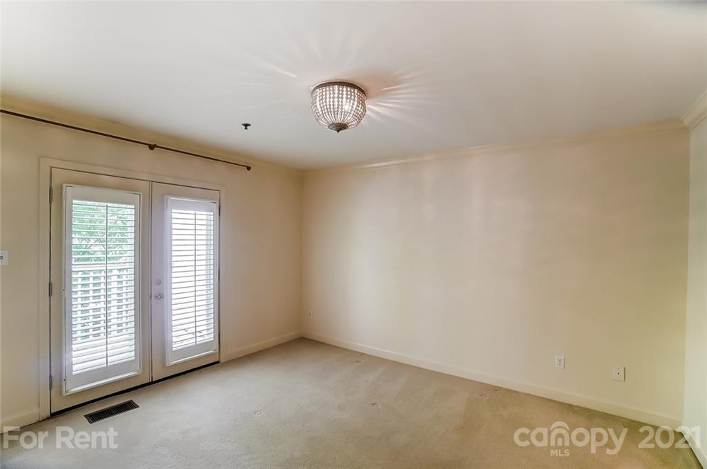416 Queens Road Charlotte, NC 28207 - Photo 12 of 25 a view of an empty room with a window