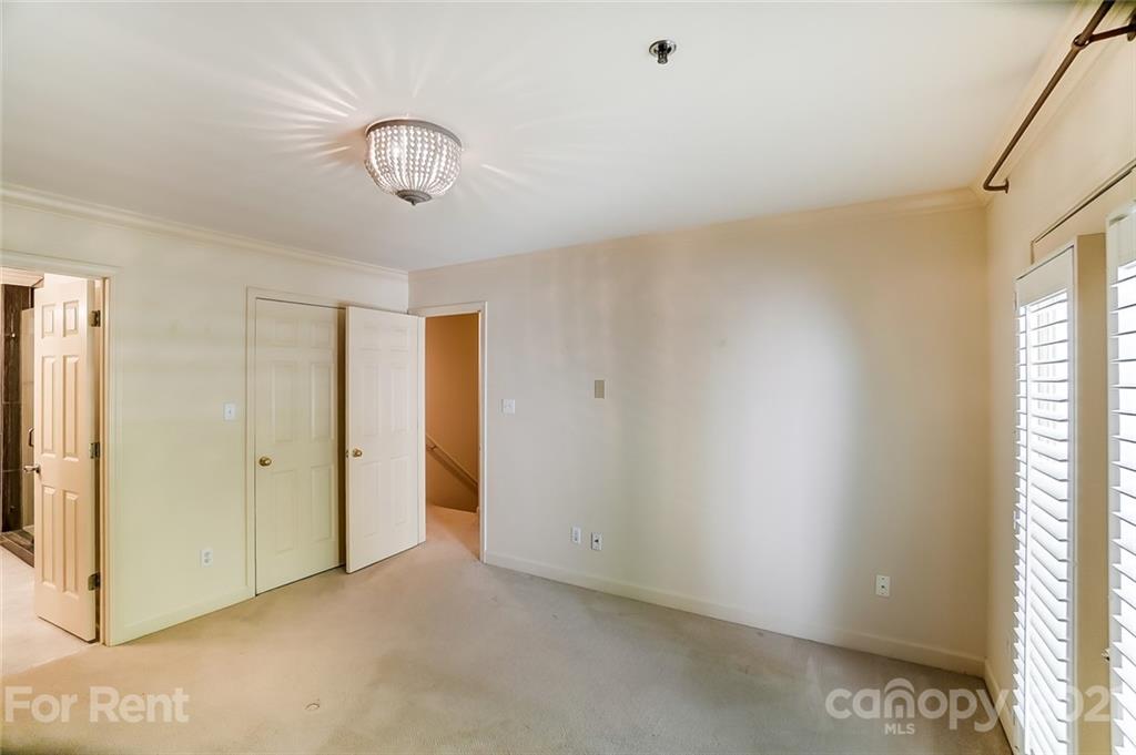 416 Queens Road Charlotte, NC 28207 - Photo 13 of 25 a view of an empty room with a window