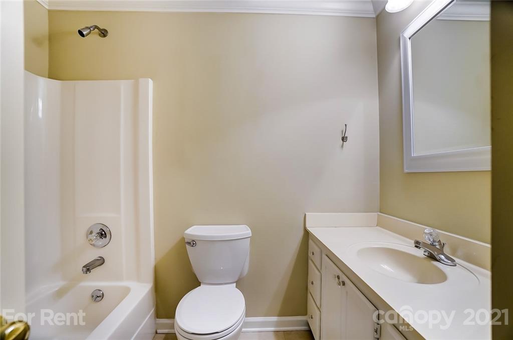 416 Queens Road Charlotte, NC 28207 - Photo 19 of 25 a bathroom with a granite countertop sink toilet and shower