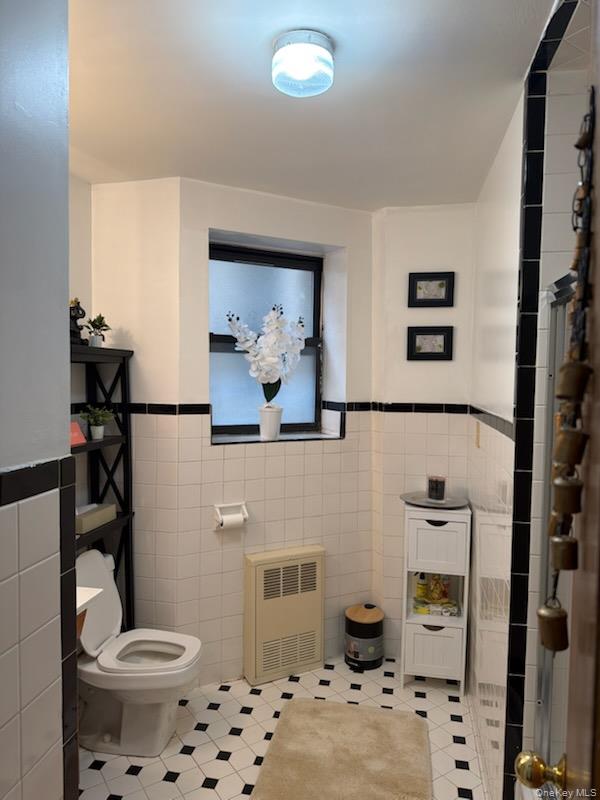 515 West 151st Street, Unit 4W Manhattan, NY 10031 - Photo 7 of 12 a bathroom with a sink a toilet and a mirror