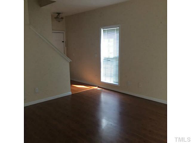 4240 Beacon Crest Way Raleigh, NC 27604 - Photo 5 of 16 Beautiful laminate floor in the living room.