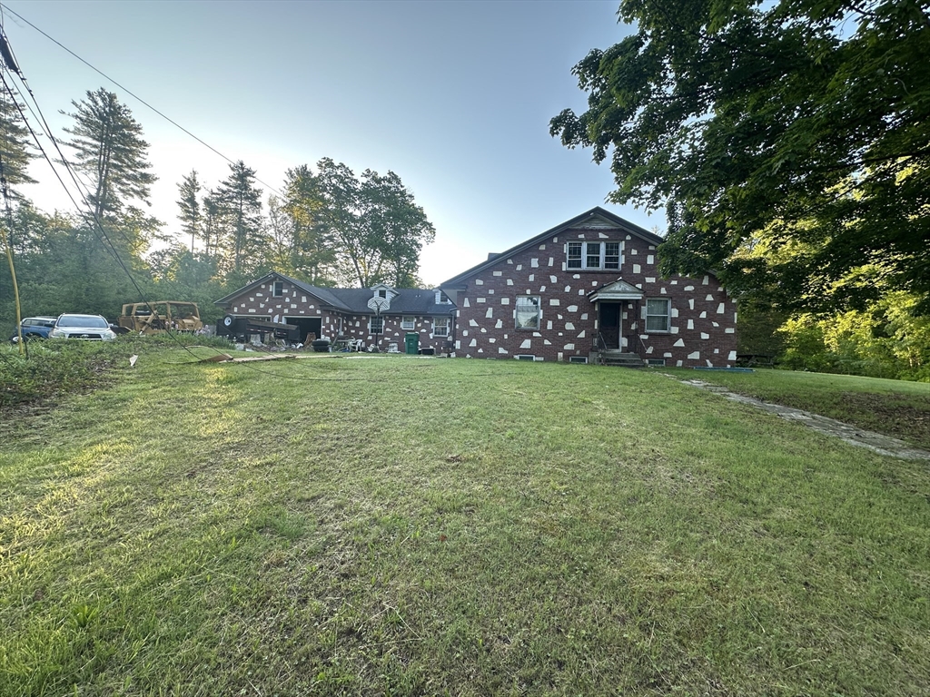 12 R Jackielyn Circle Granby, MA 01033 - Photo 1 of 17 a view of a field of grass and trees