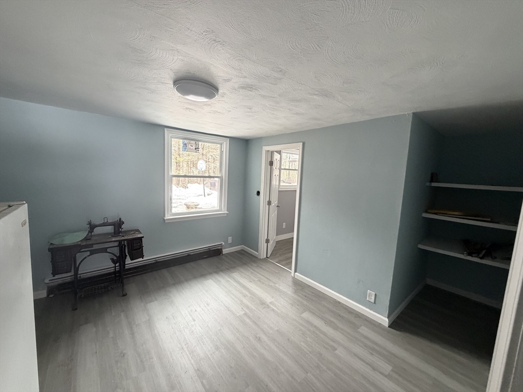 12 R Jackielyn Circle Granby, MA 01033 - Photo 15 of 23 wooden floor in an empty room with a window