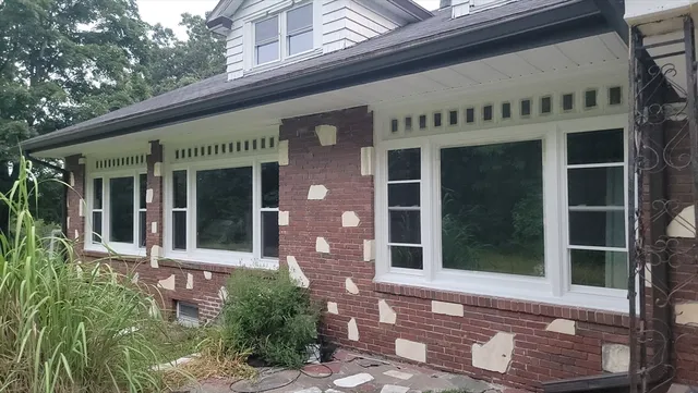 a view of house with outdoor seating space