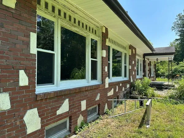 a view of backyard with green space