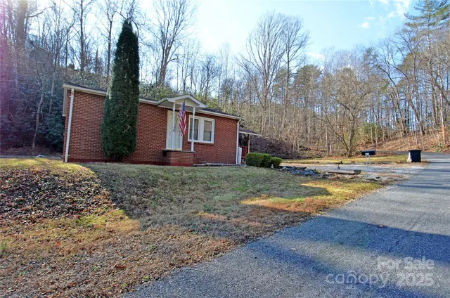 a view of a house with snow on the road