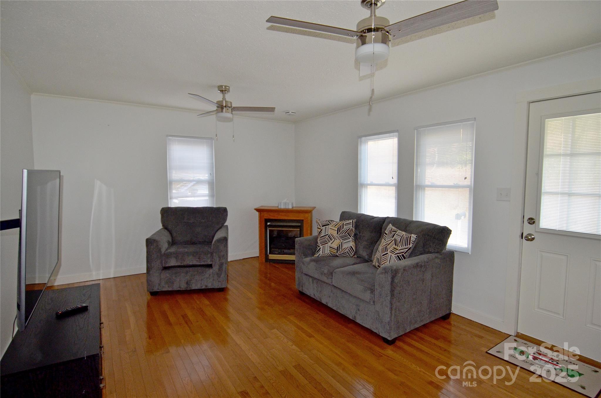 93 John Gilkey Road Marion, NC 28752 - Photo 6 of 13 a living room with furniture and a wooden floor