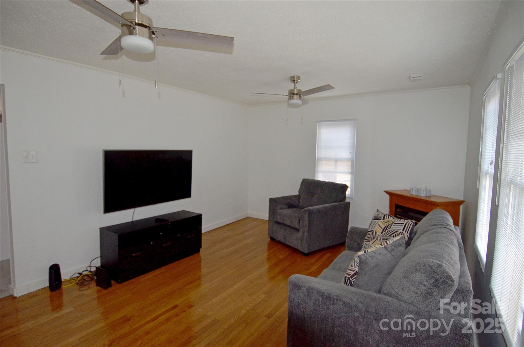 93 John Gilkey Road Marion, NC 28752 - Photo 7 of 13 a living room with furniture and a flat screen tv