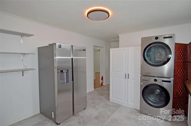 a view of a storage and utility room with washer and dryer