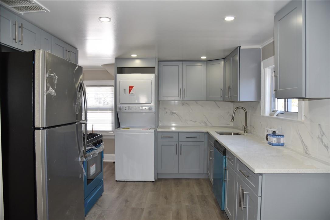 99 Maple Avenue, Unit 3 Rye, NY 10580 - Photo 1 of 1 a kitchen with a refrigerator a sink and dishwasher