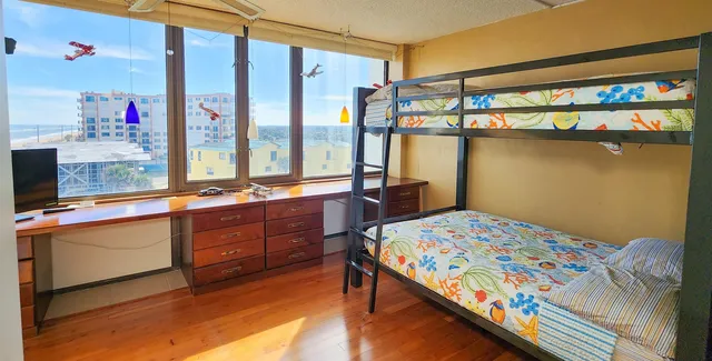 a bedroom with a bed and a table in it