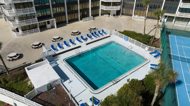 a view of living room with furniture and flowers