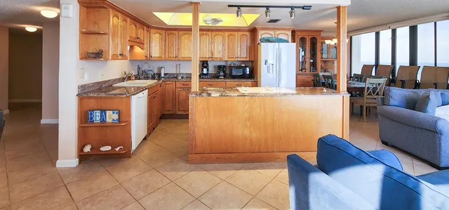 a view of kitchen with furniture and large windows