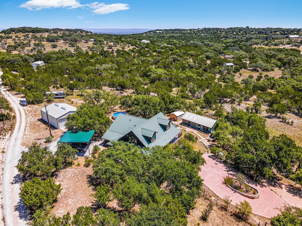 254 Middleton Road Spicewood, TX 78669 - Photo 32 of 32 an aerial view of a house with a yard
