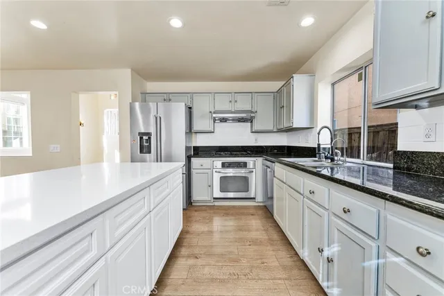 a large kitchen with cabinets