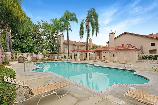 a view of a swimming pool with a patio