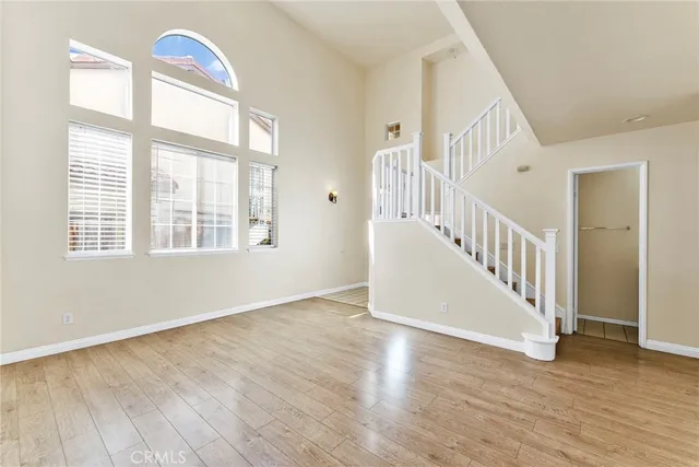 a view of an entryway with wooden floor and windows
