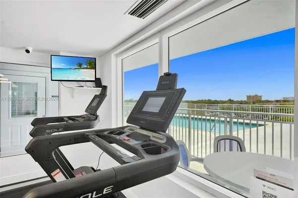 a kitchen with granite countertop a stove and cabinets