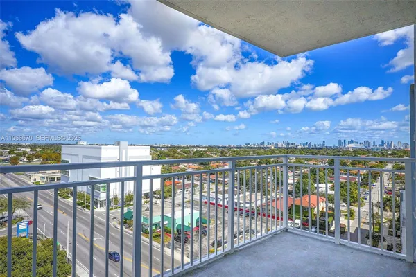 a view of a parking area and a building