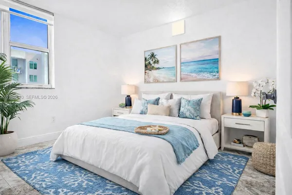 a bedroom with bed and window