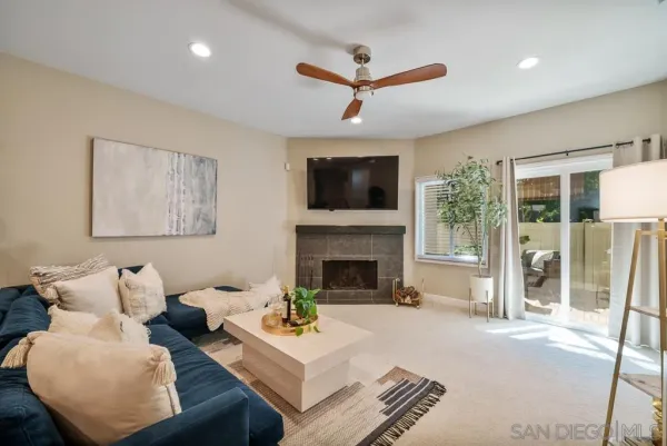 a living room with furniture and a fireplace