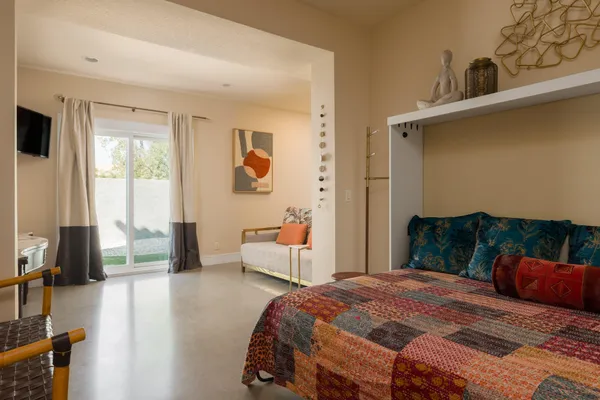 a bedroom with furniture and a bed
