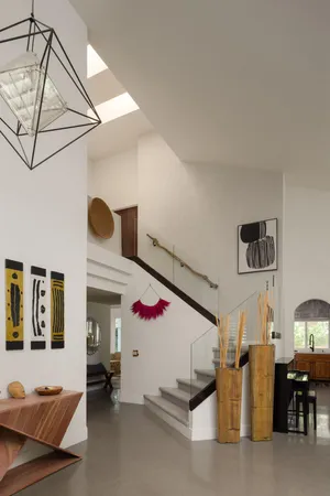 a living room with furniture and flat screen tv