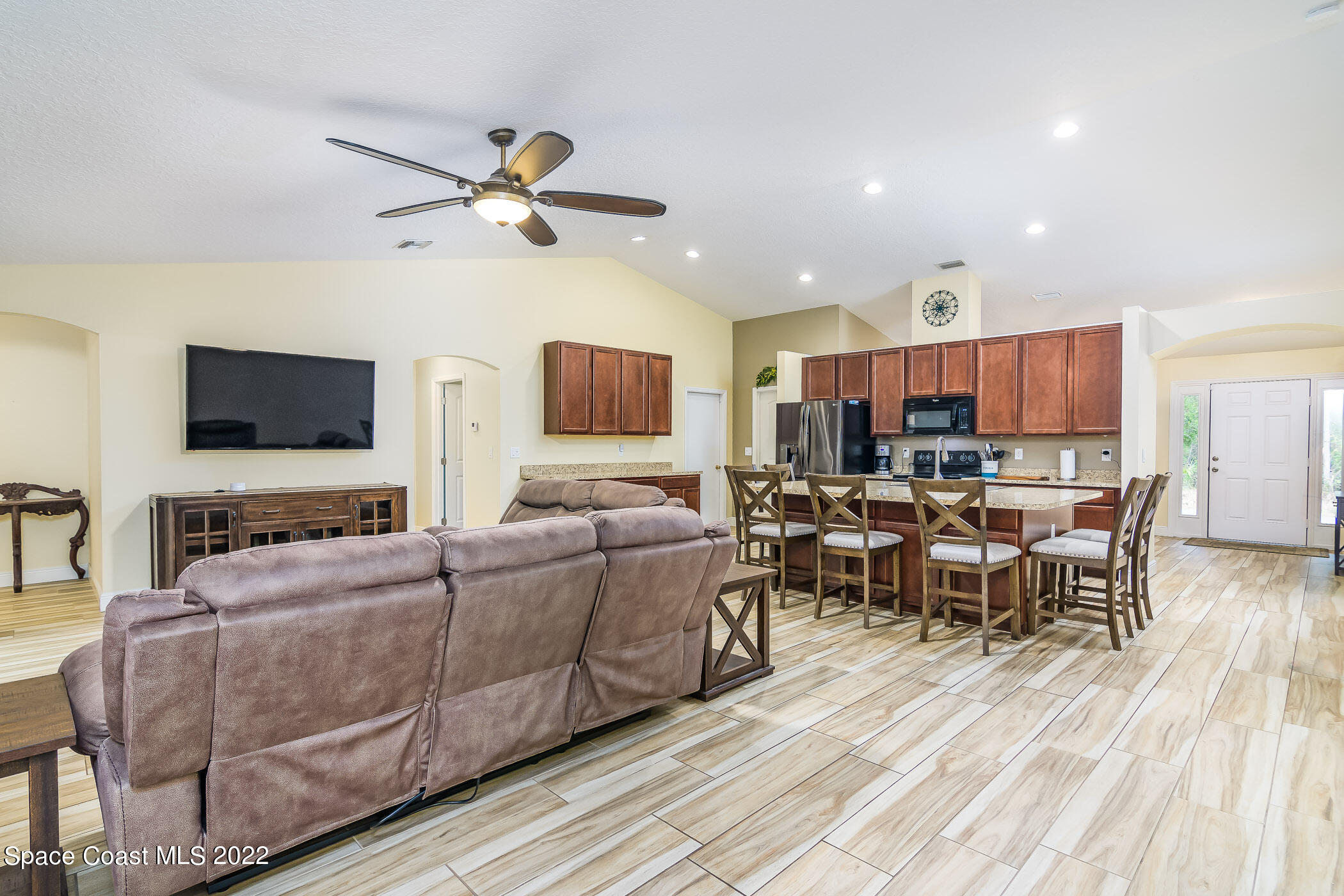 3268 Reef Road Southeast Palm Bay, FL 32909 - Photo 12 of 39 Great room & kitchen