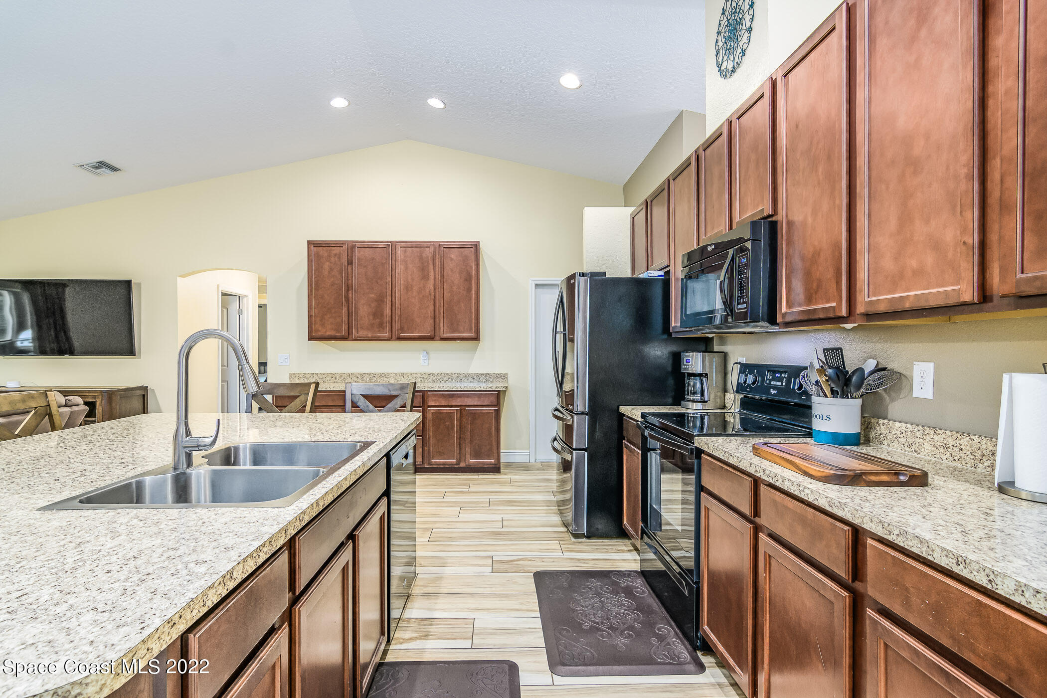 3268 Reef Road Southeast Palm Bay, FL 32909 - Photo 7 of 39 Kitchen w/ maple nutmeg cabinets
