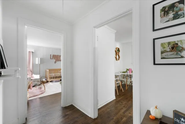 a kitchen with stainless steel appliances granite countertop a stove top oven a sink dishwasher and a refrigerator with wooden floor