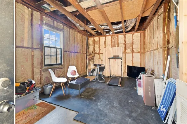 an aerial view of a house with a yard basket ball court and outdoor seating