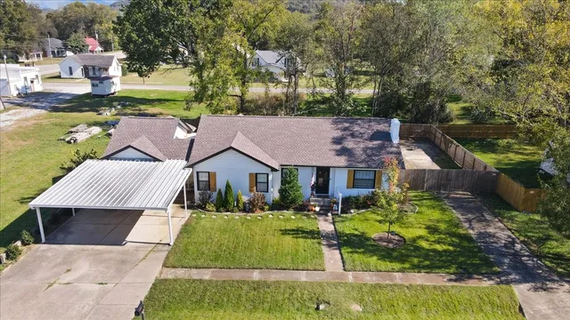 front view of a house with a swimming pool