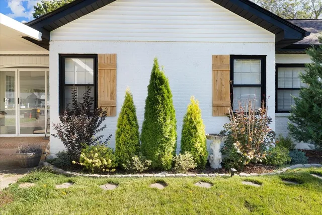 a house with a tree in front of it